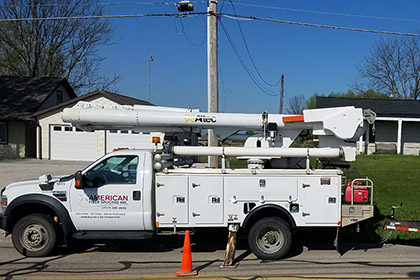 service truck parked along street in service ready position